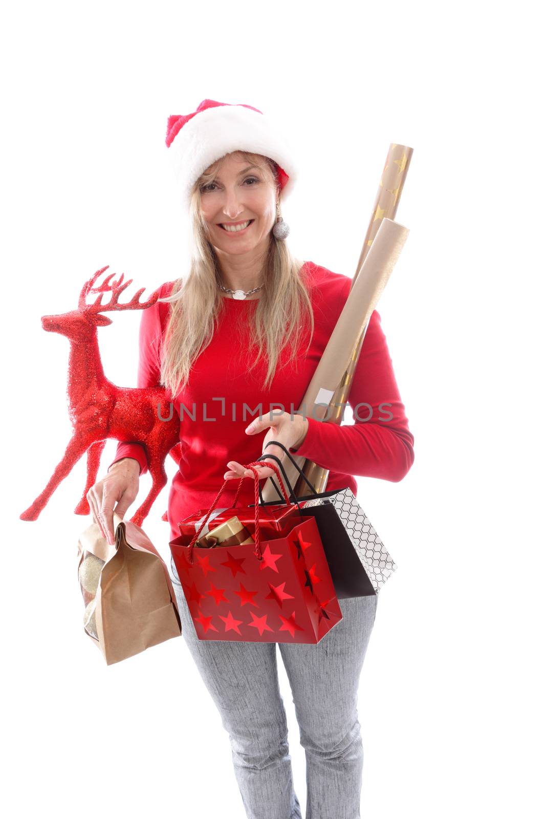 A woman carrying various gifts and decorations for Christmas by lovleah