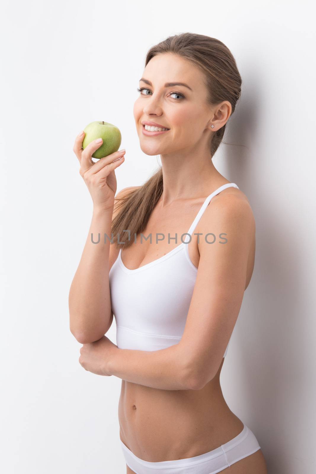 Sporty woman with apple by Yellowj