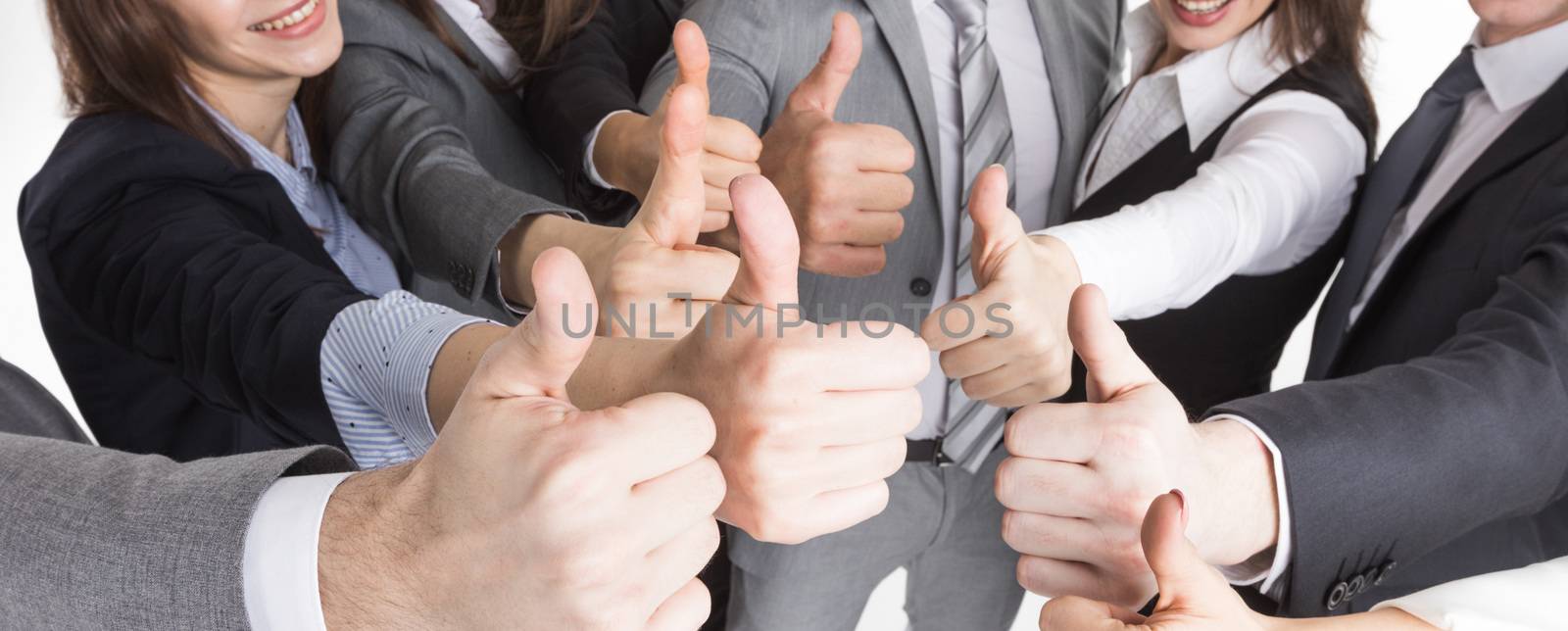 Cheering business people holding many thumbs thumbs up closeup