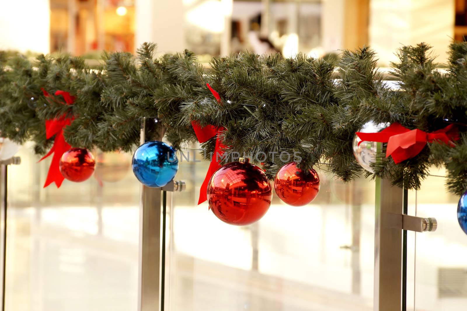 Christmas decoration of shopping center spheres, bows and branches of a fir-tree