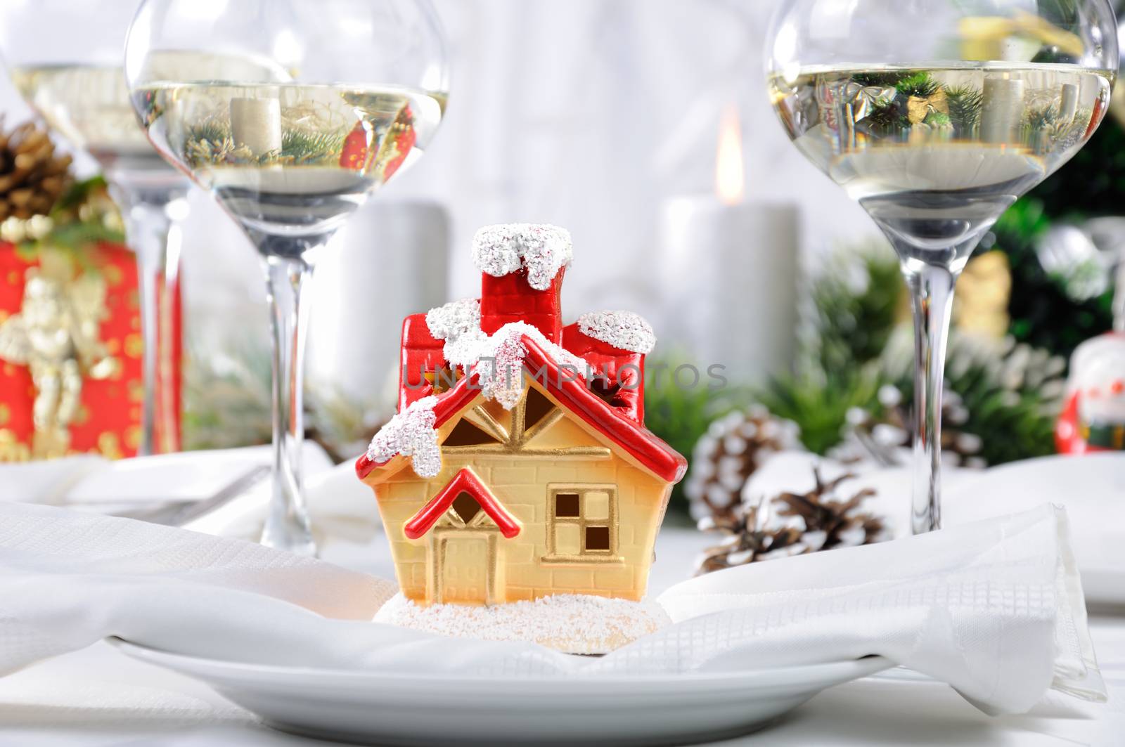 Souvenir in the form of a Christmas house on the Christmas table