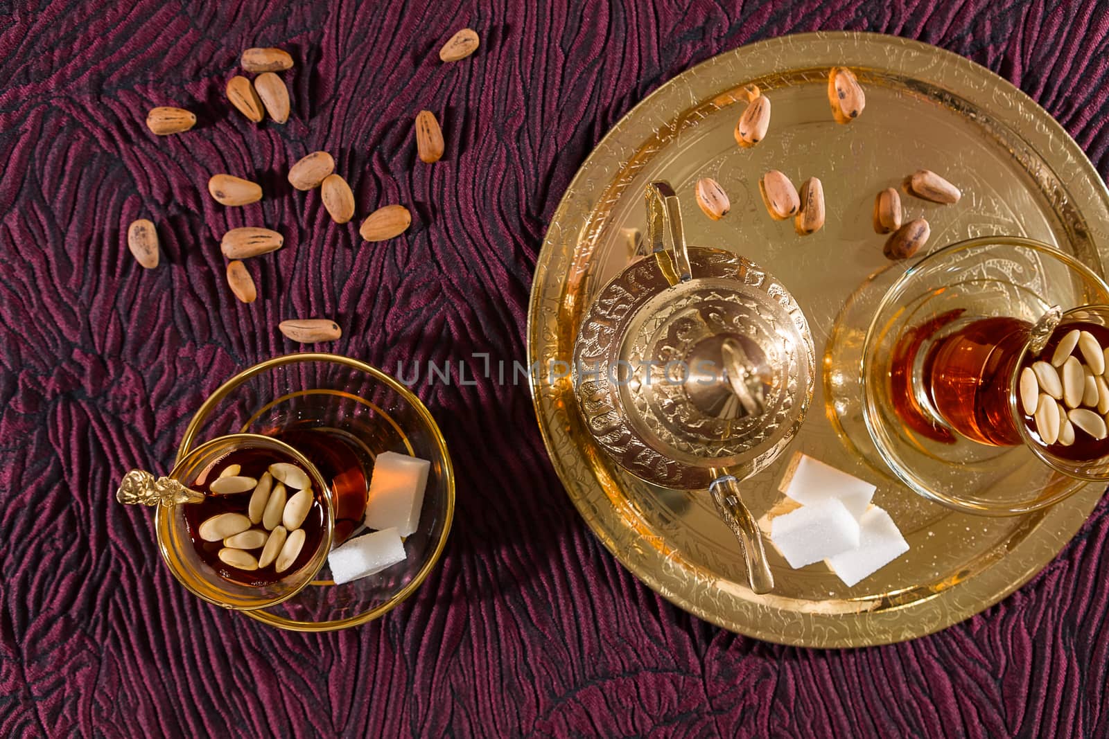 Tunisian tea in traditional glass seen from above