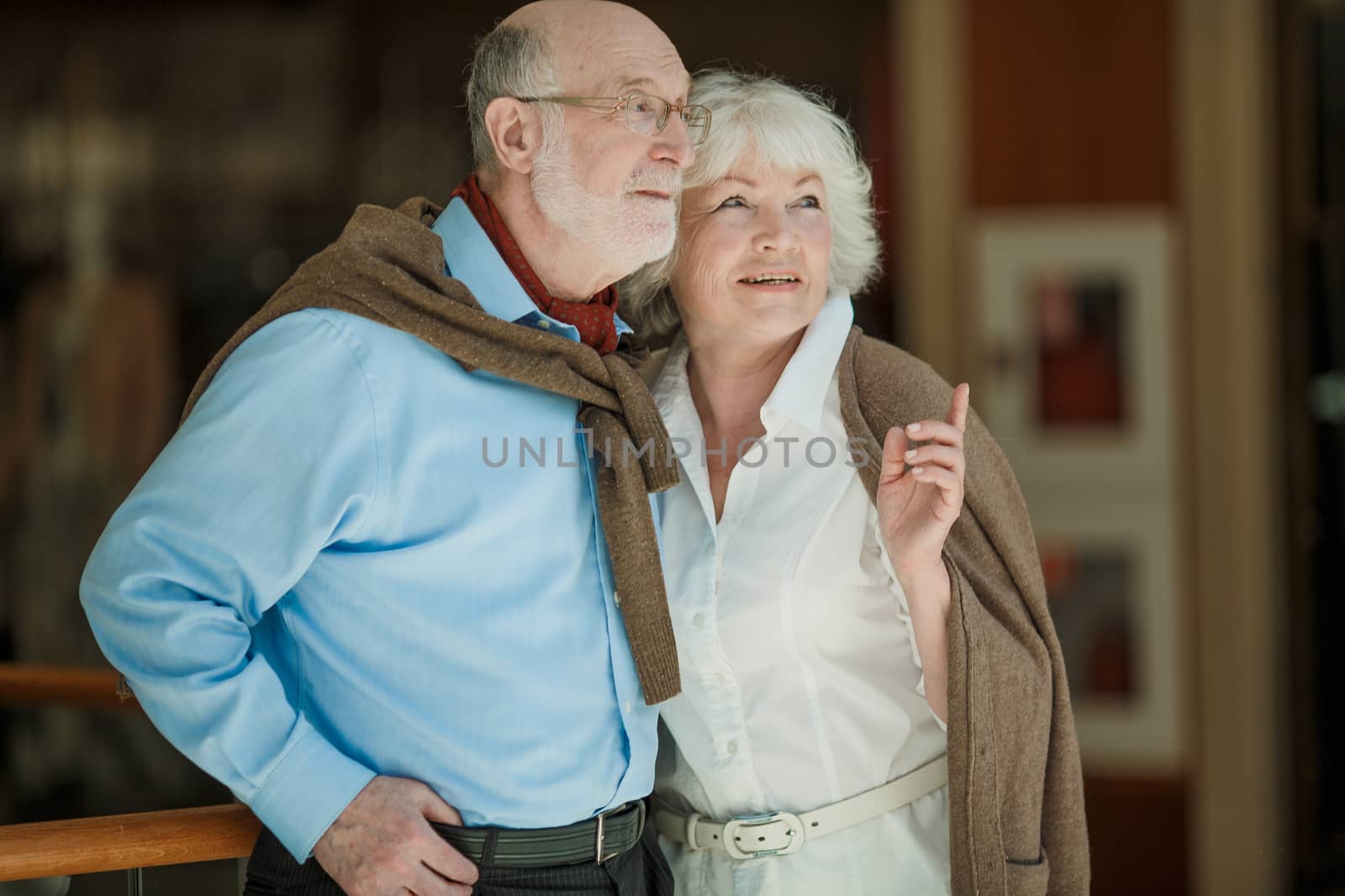 Portrait of senior couple looking together aside and embracing