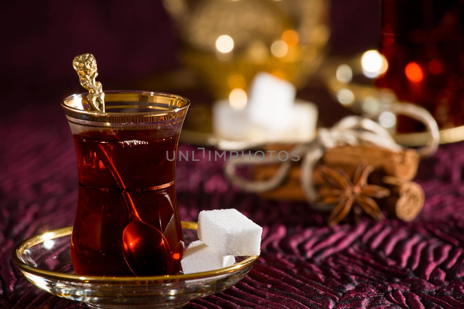 Closeup of Turkish tea in traditional glass and sugar cube