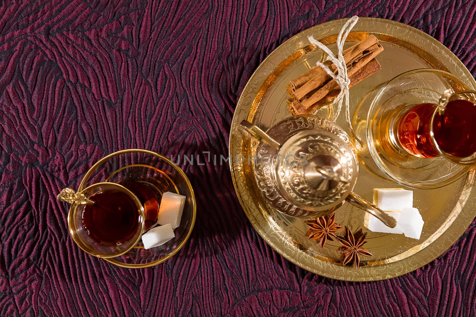 Turkish tea in traditional glass and tray seen from above