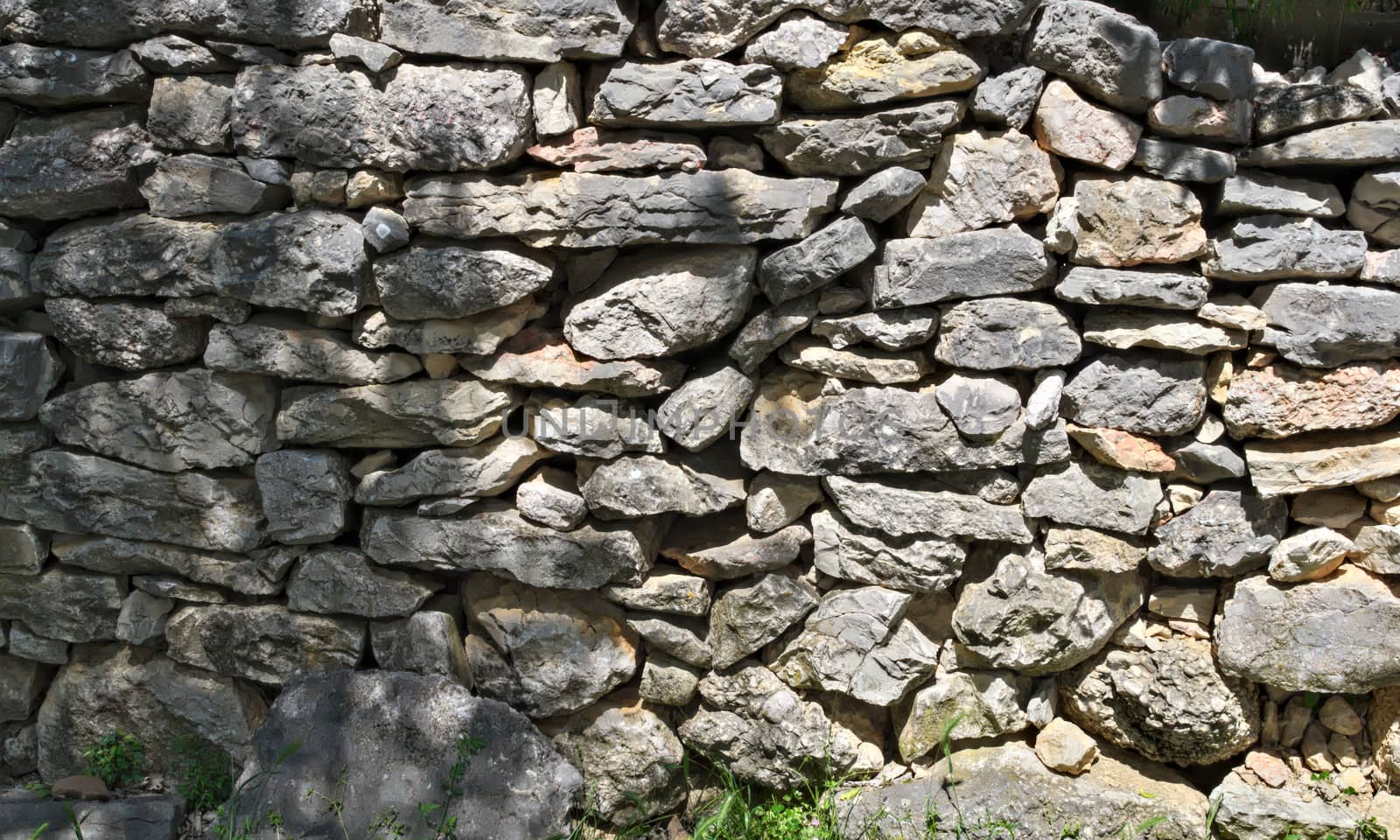 Stone fence wall, close up by sheriffkule