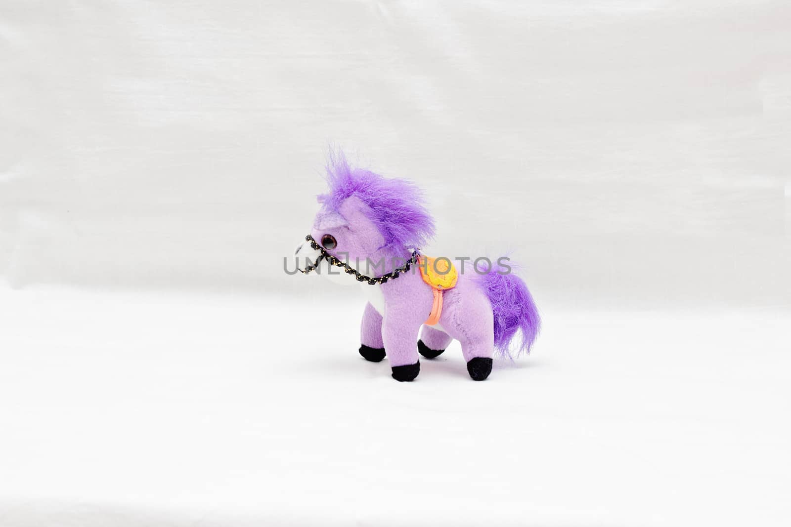 Souvenir soft horse pony violet isolated on white background.