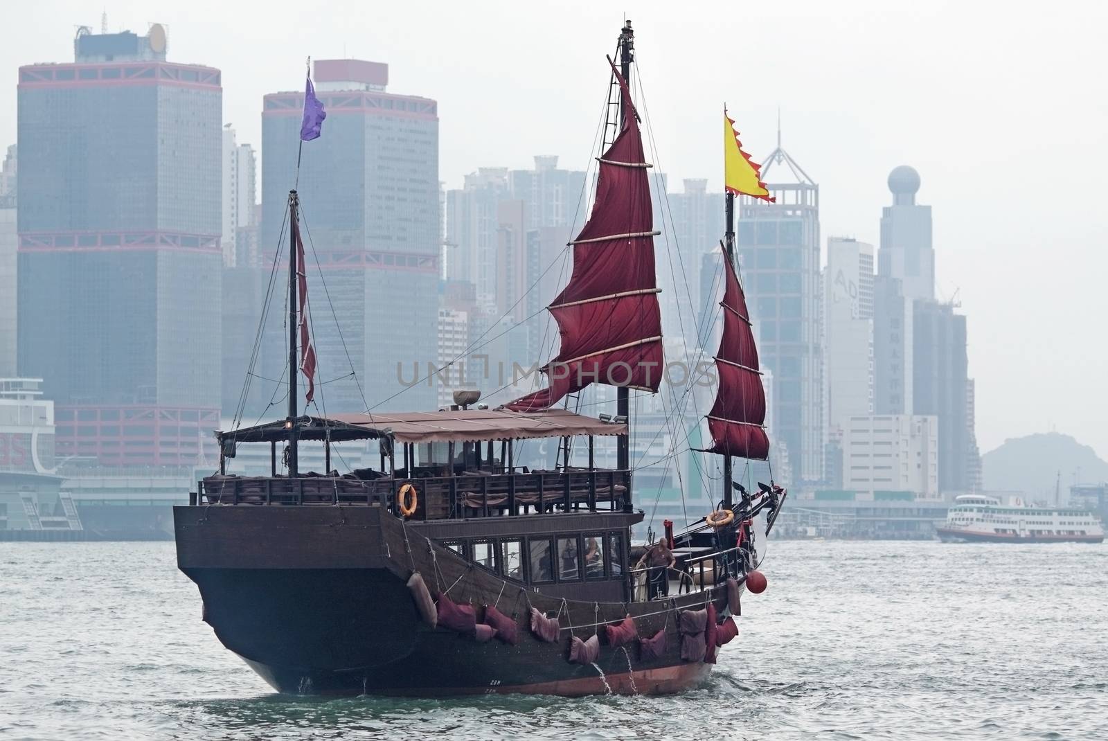 sailboat in Hong Kong harbor at day