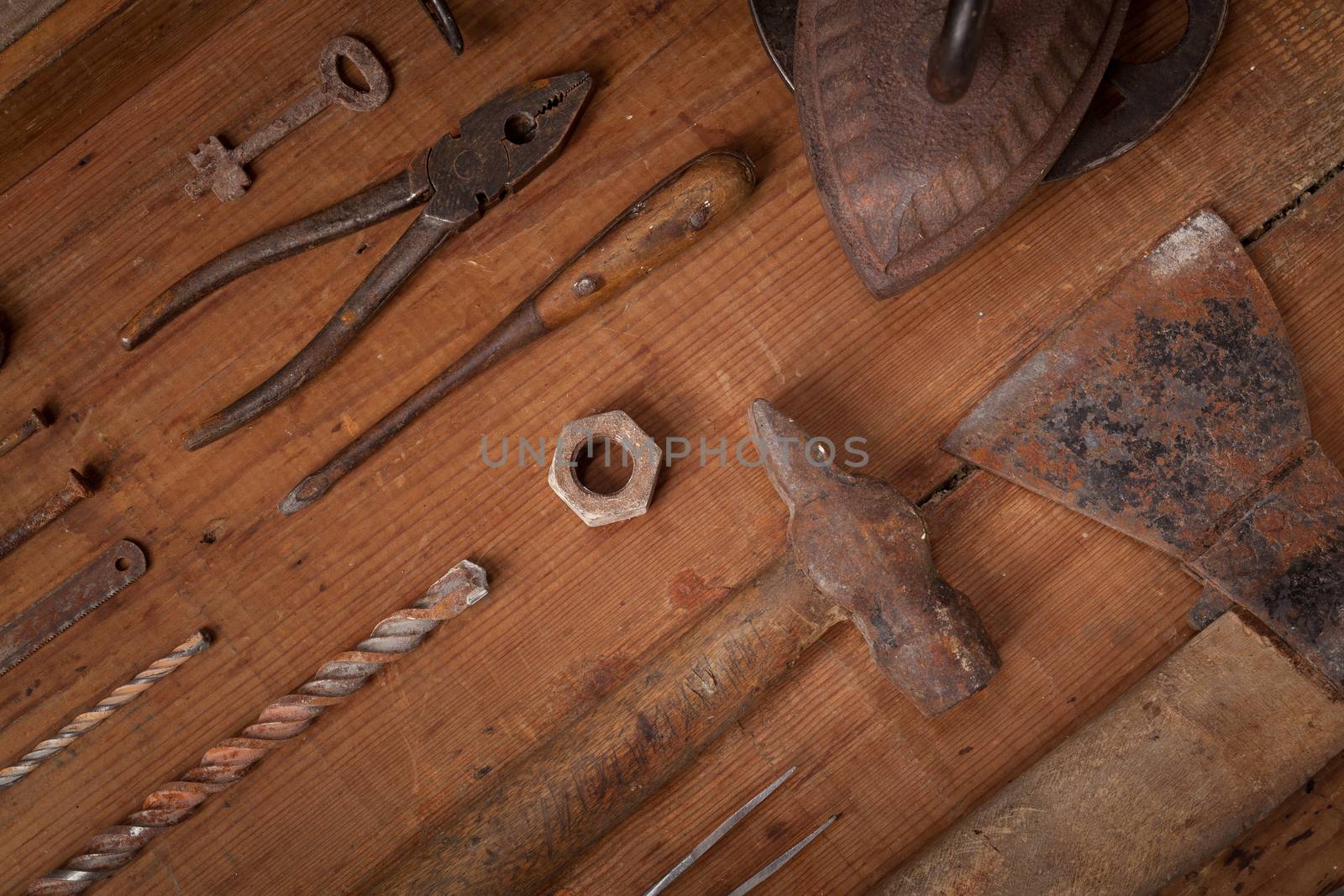 Collection of vintage tools on wooden background by igor_stramyk