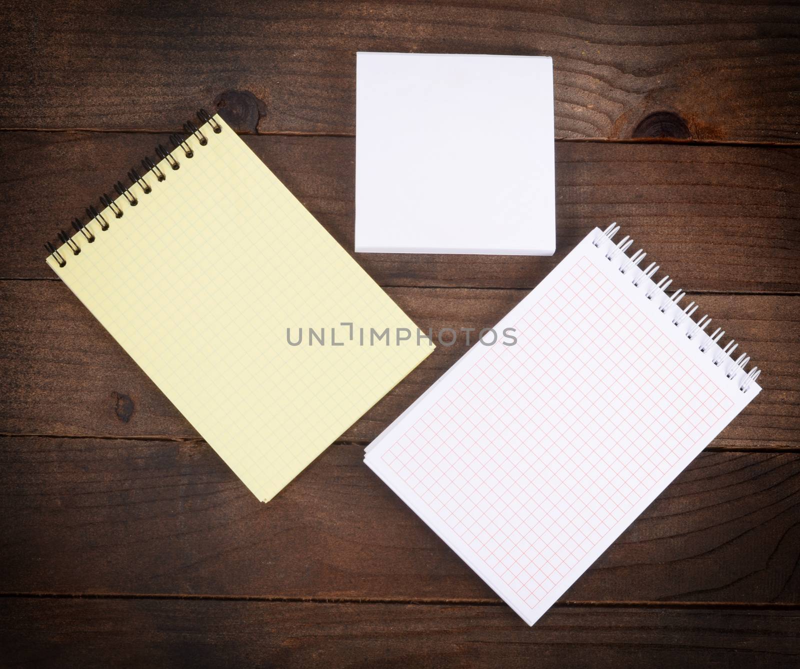 The different notebooks on a wooden table