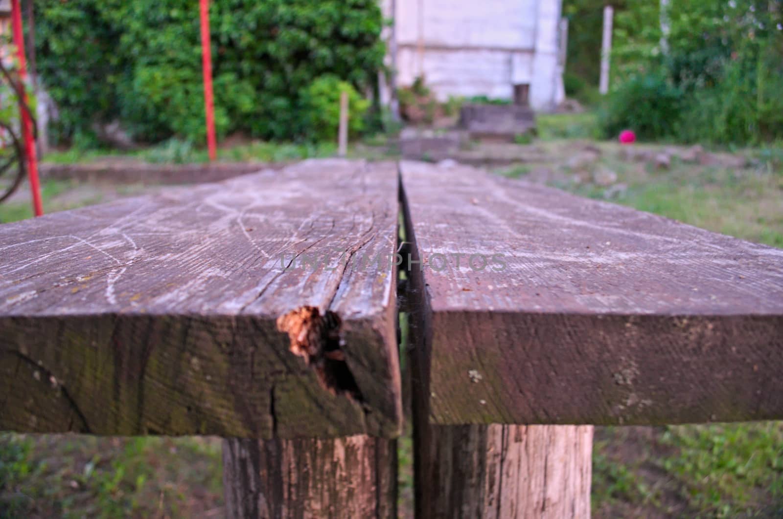 Wooden table in yard, close up by sheriffkule