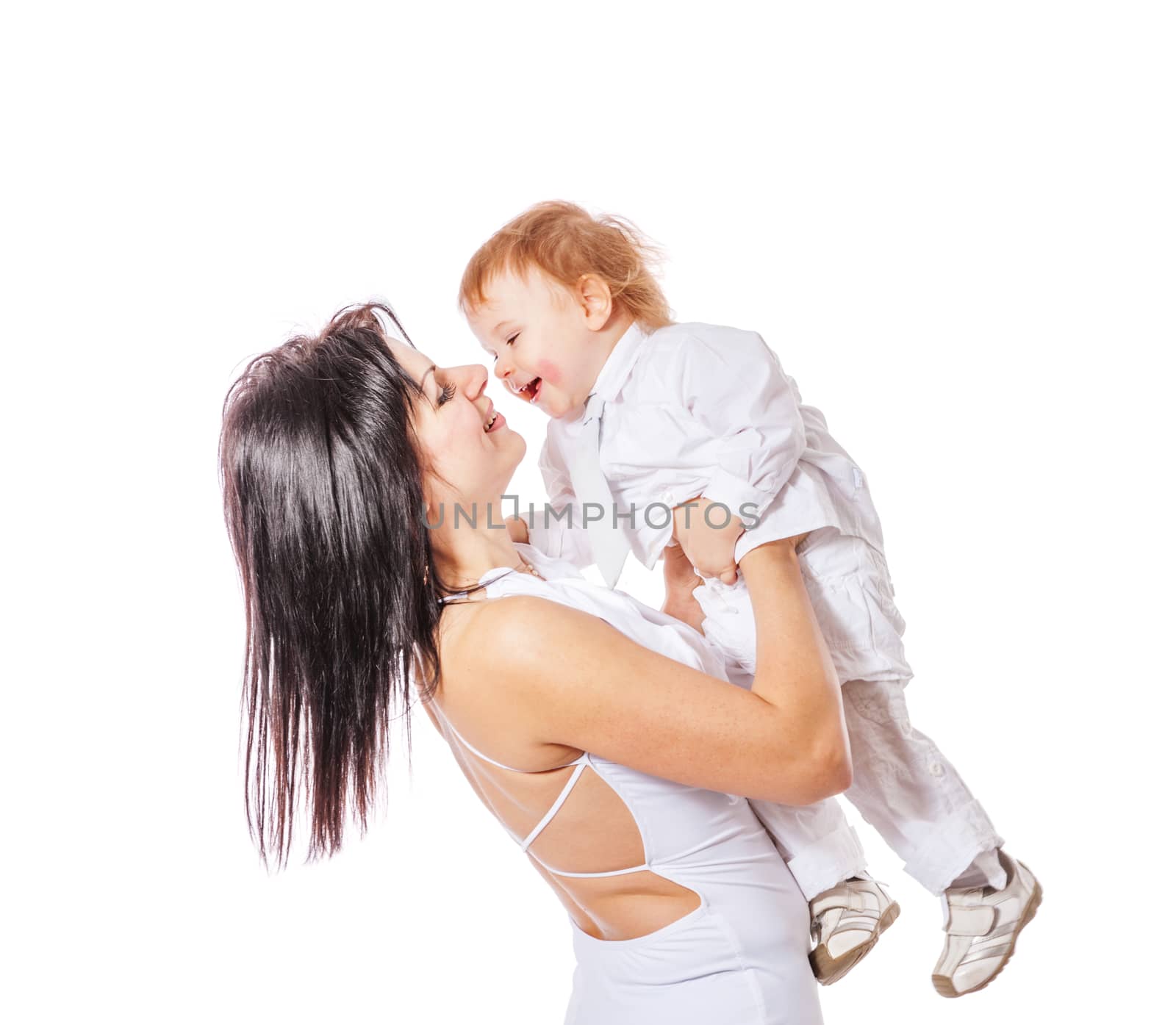 Happy Mother holding son both wearing white isolated