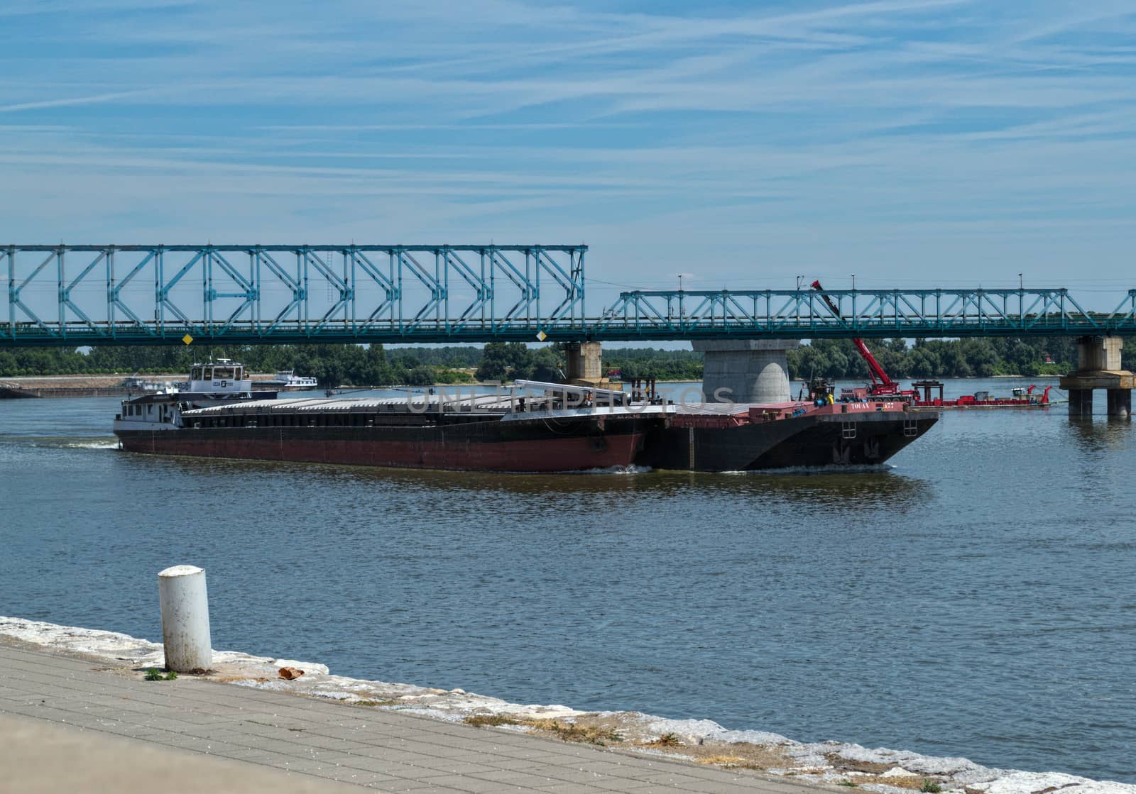 Boat slowly riding on Danube river in Novi Sad, Serbia