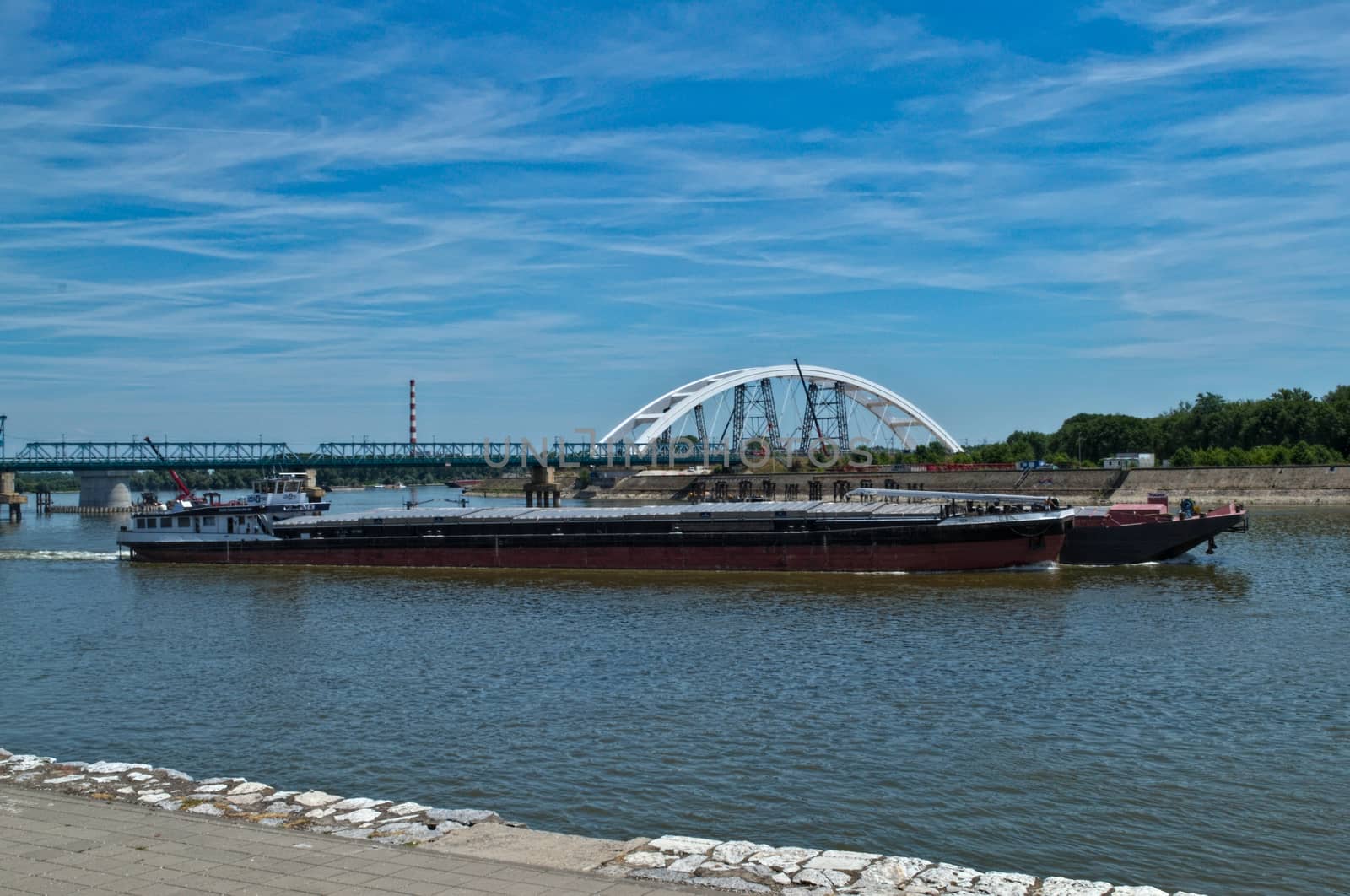 Boat slowly riding on Danube river in Novi Sad, Serbia