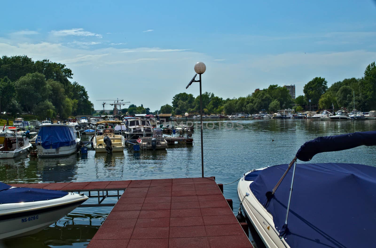 Boats at Danube pier dock in Novi Sad, Serbia by sheriffkule