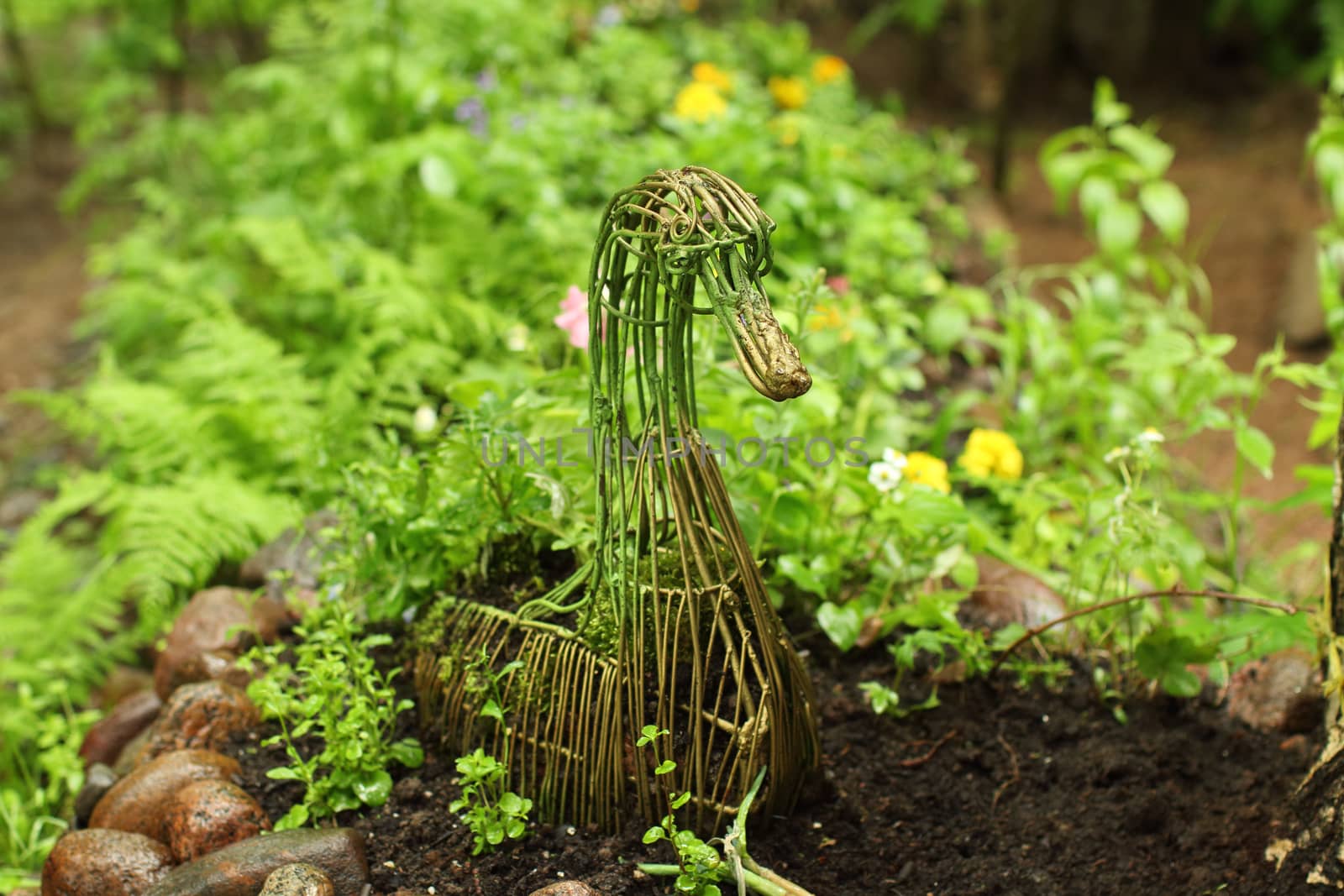 garden bed with decorative figure of a goose