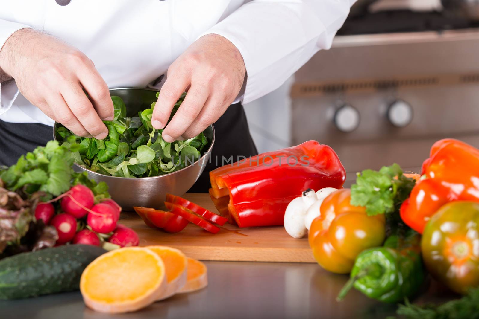 Chef cutting fresh and delicious vegetables for cooking