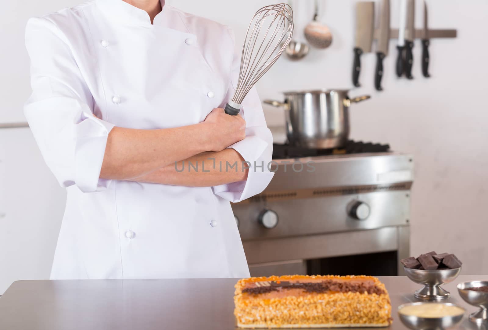 Pastry chef presenting a yolk and cream cake