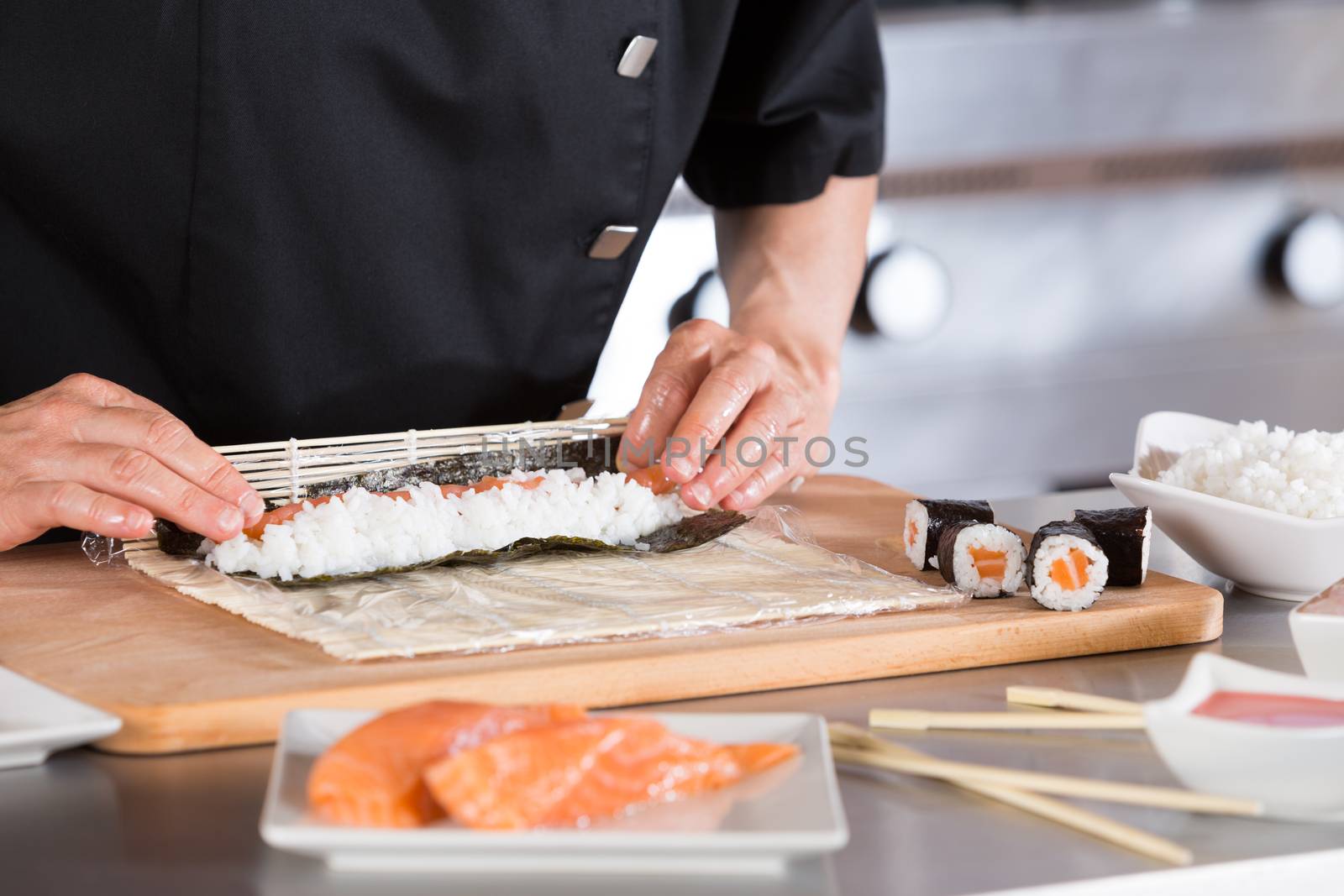 Chef preparing delicious sushi in a restaurant
