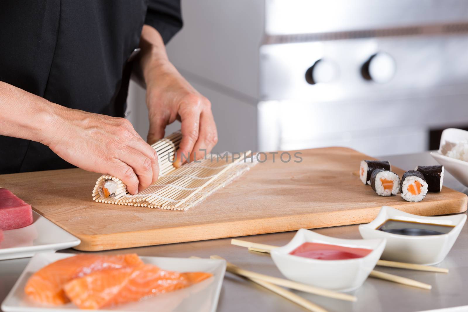 Chef preparing delicious sushi in a restaurant
