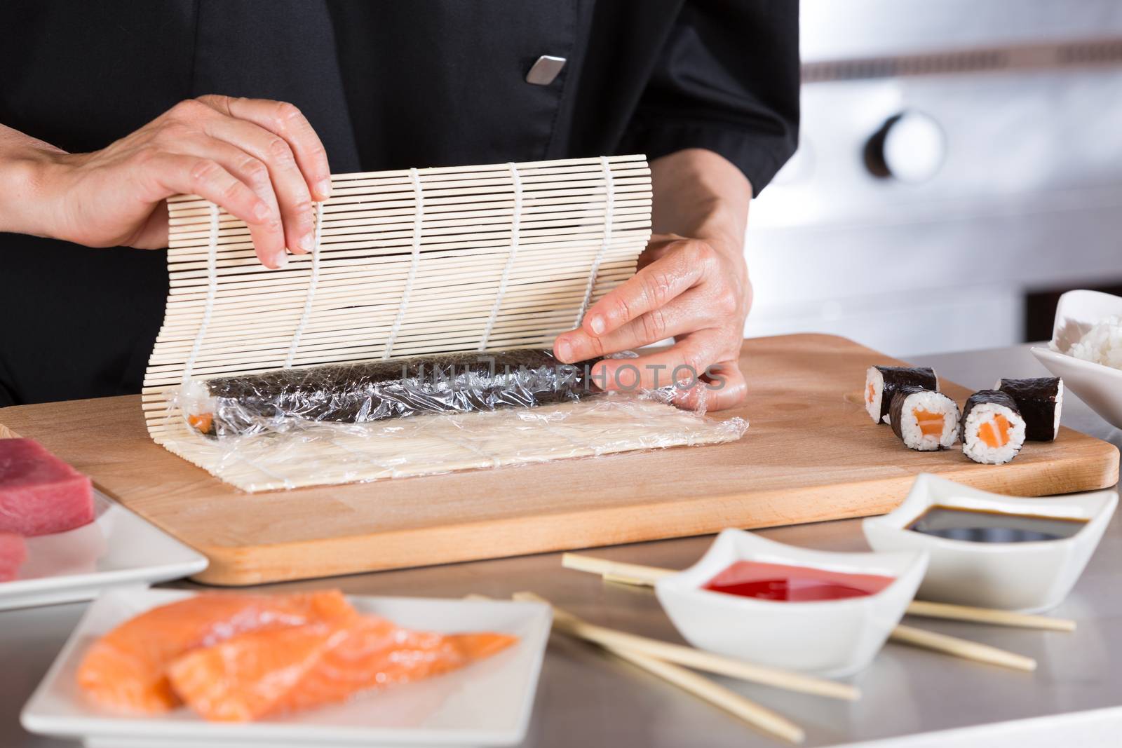 Chef preparing delicious sushi in a restaurant