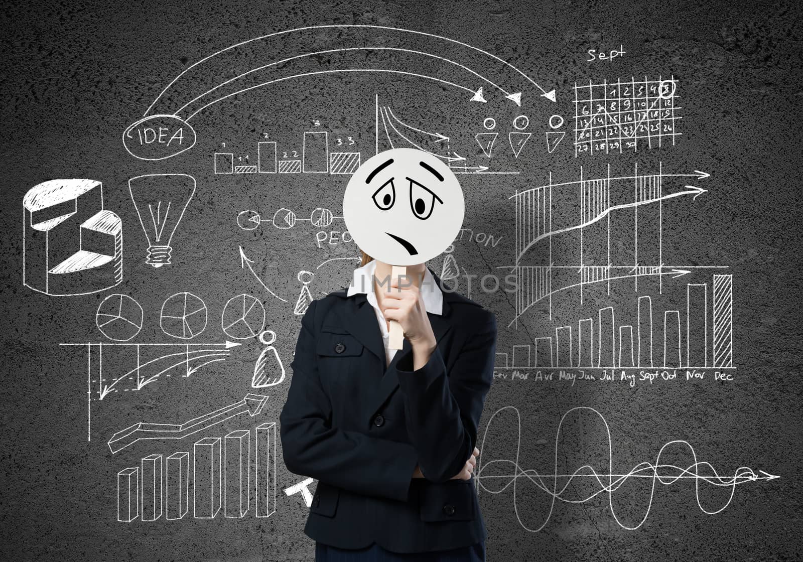 Businesswoman and graphs at background hiding her face behind mask