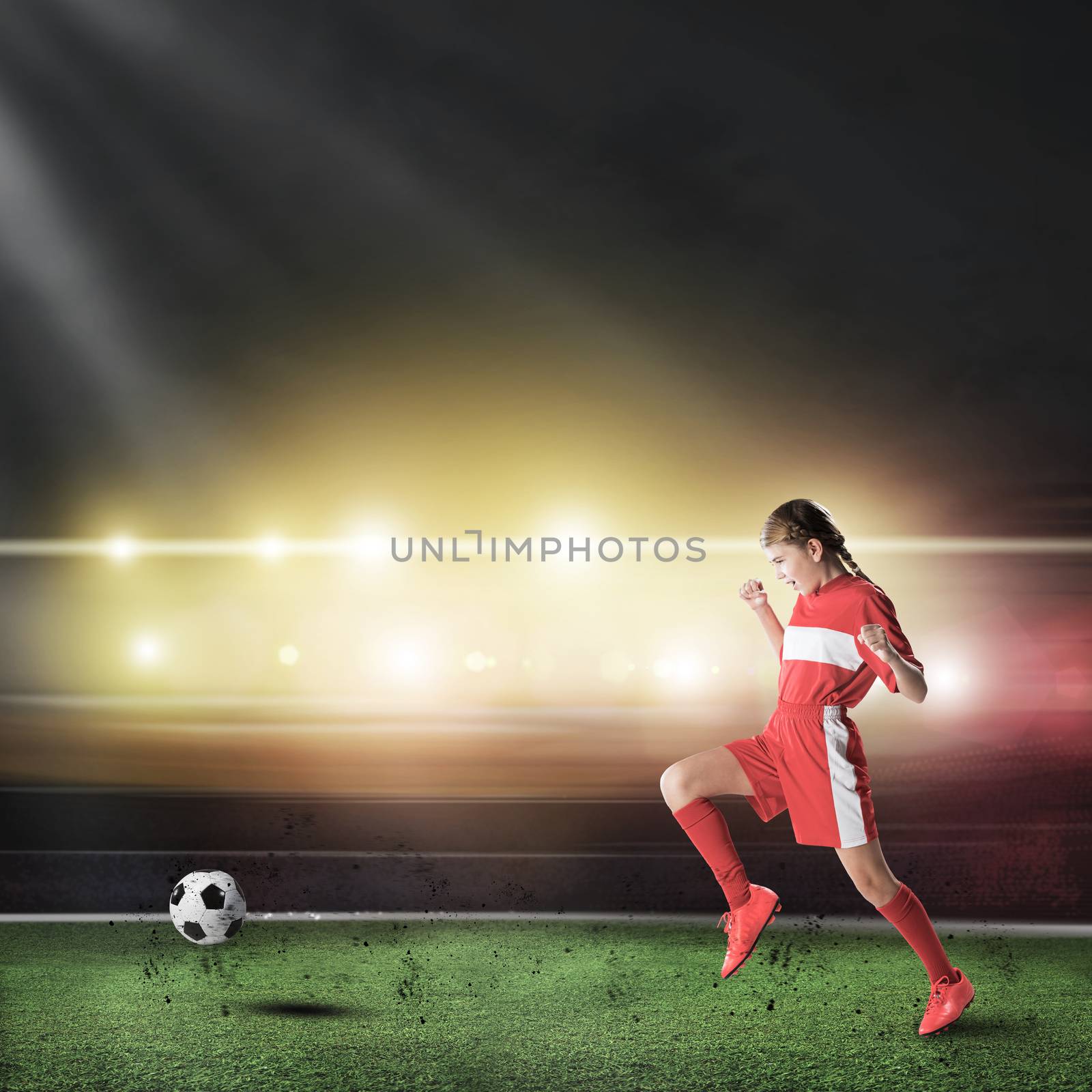 Teenager girl  with the ball at stadium