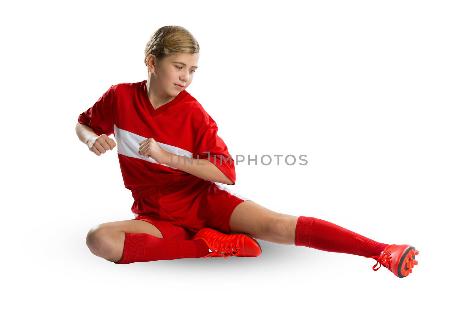 Teenager girl in red uniform isolated on white 