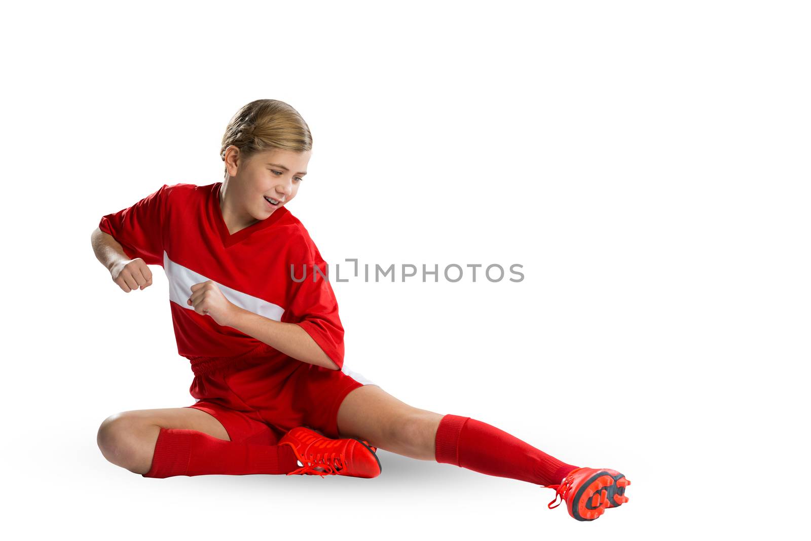 Teenager girl in red uniform isolated on white 