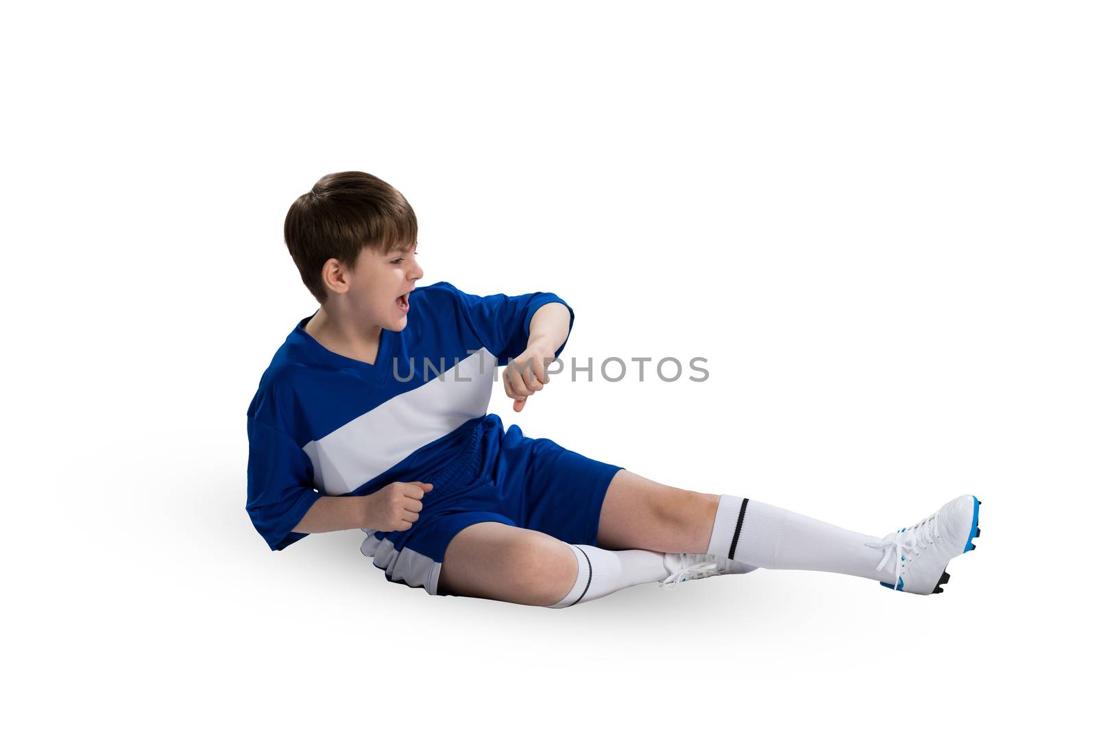 Boy football player in blue uniform against white background