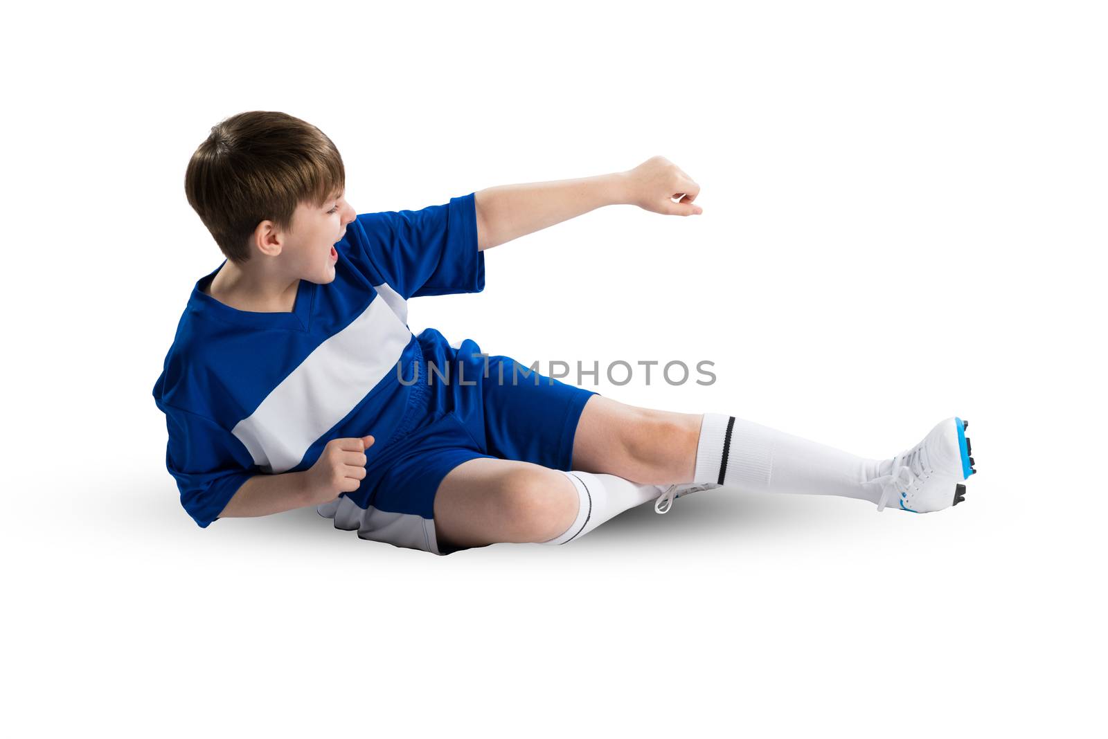 Boy football player in blue uniform against white background