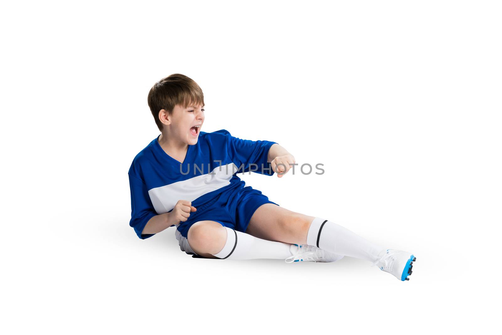 Boy football player in blue uniform against white background