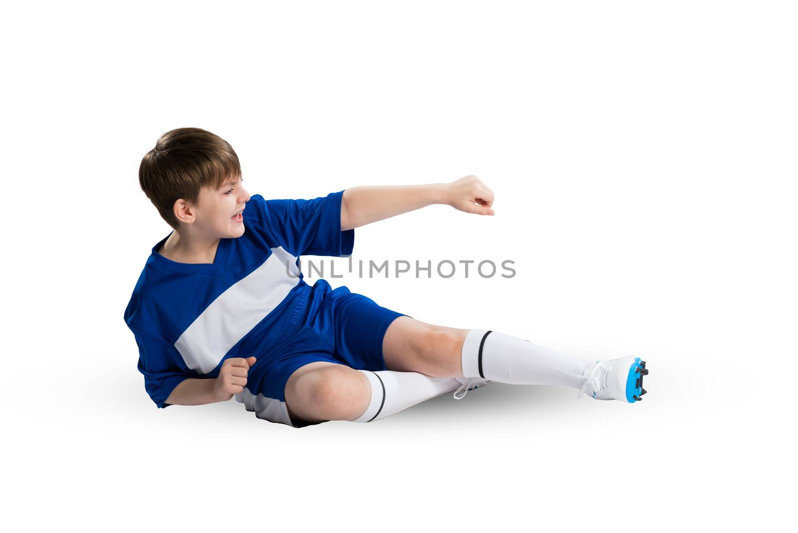 Boy football player in blue uniform against white background
