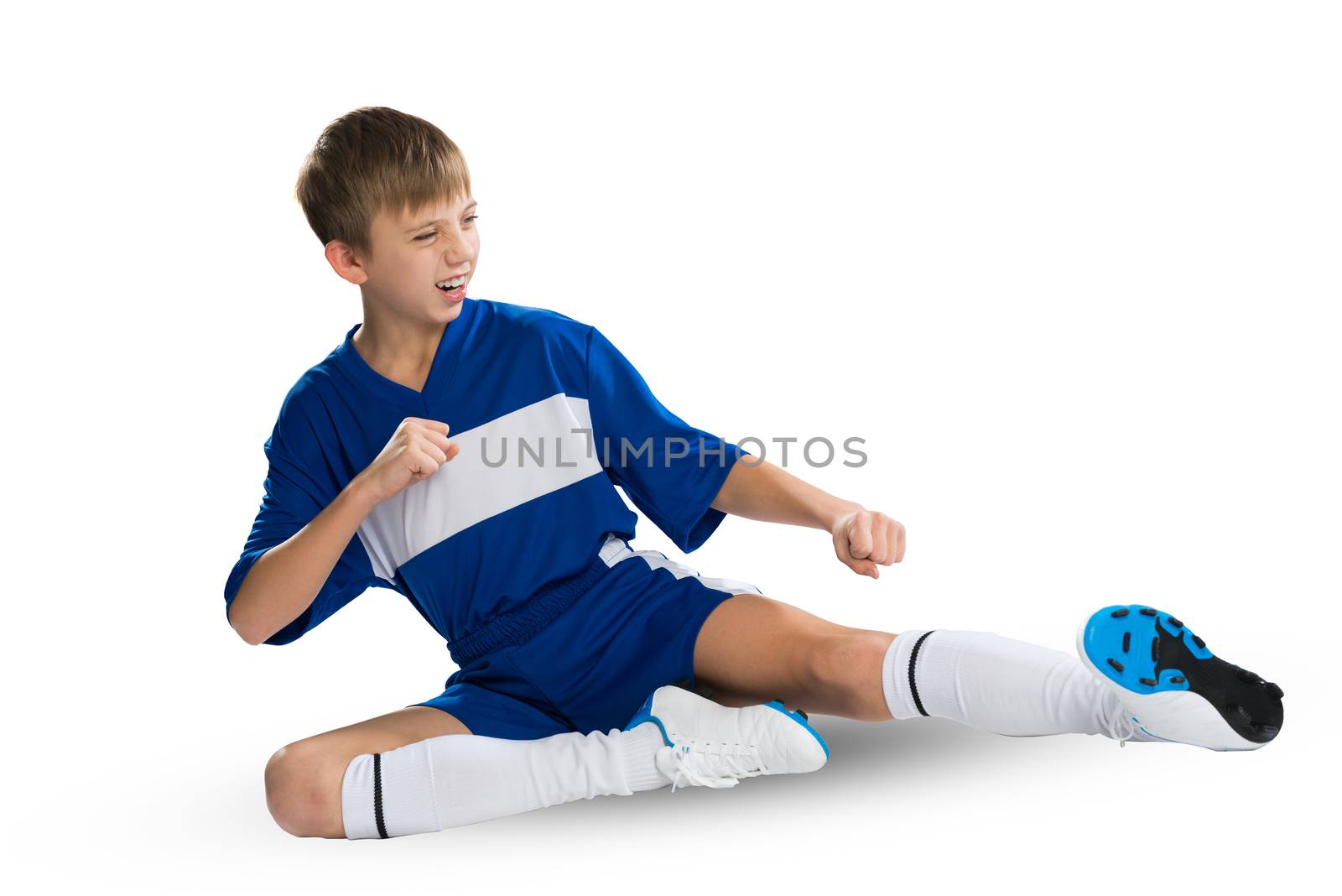 Boy football player in blue uniform against white background