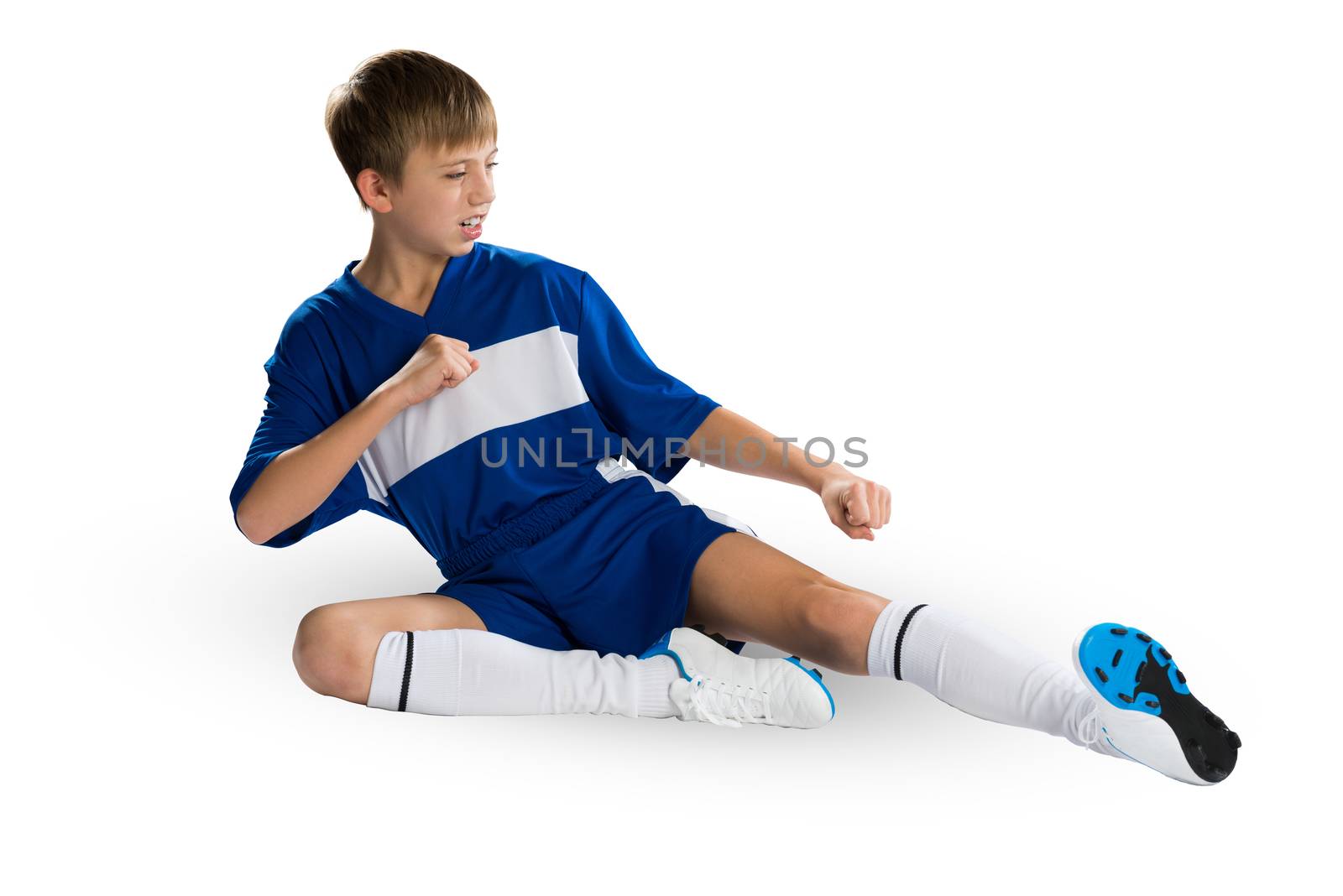Boy football player in blue uniform against white background