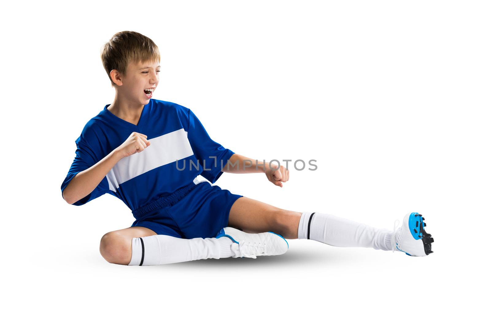 Boy football player in blue uniform against white background