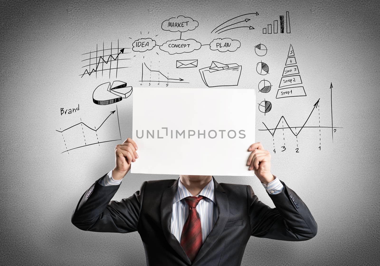 Businessman hiding his face behind sheet of paper