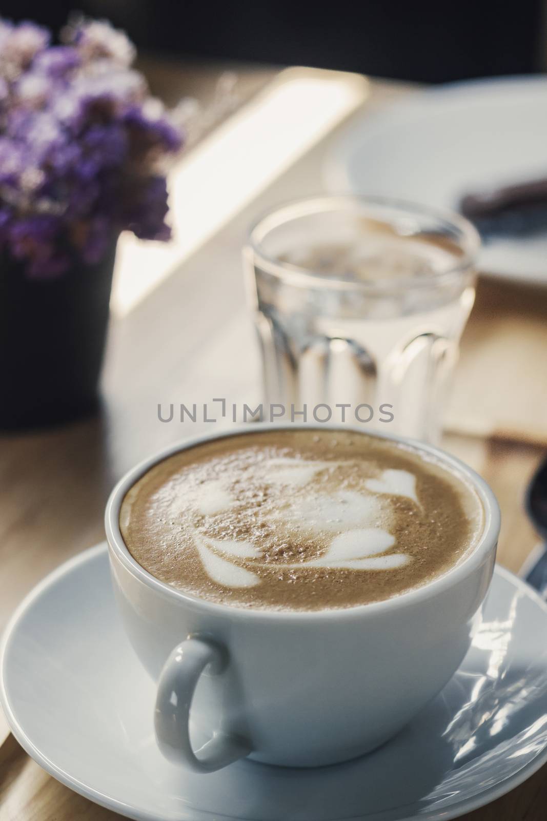 Soft focus on latte coffee cup, coffee for background - vintage effect process picture
