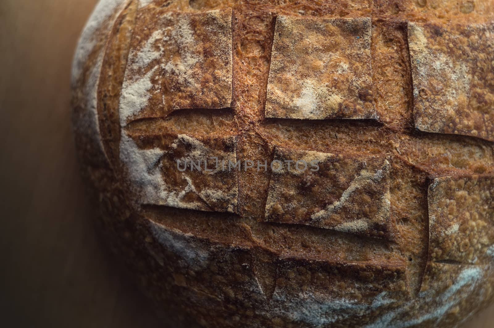 Close-up of artisan sourdough bread on wooden table