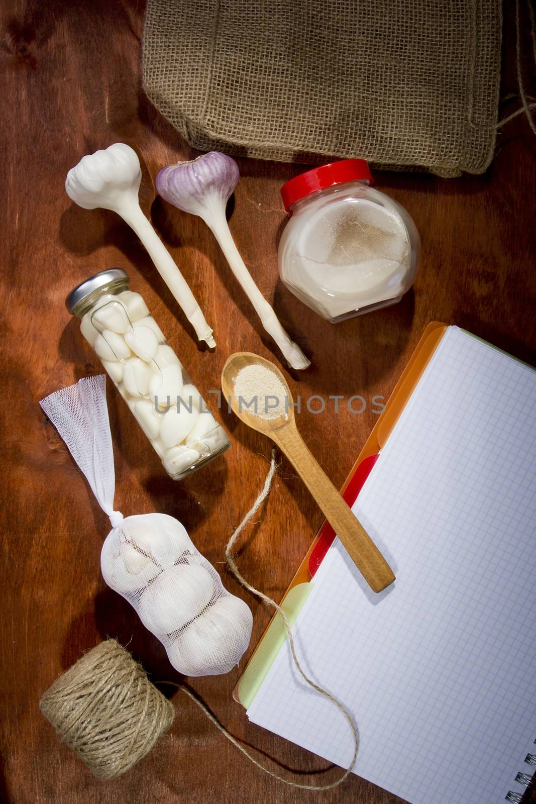 Varied garlic package on a wooden background