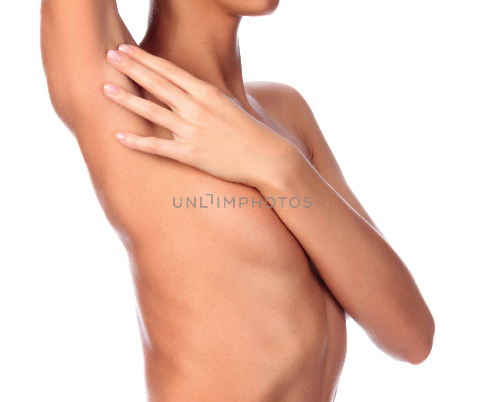 Beautiful female body, isolated on white background. Slim girl touches her shaved armpit. Unwanted hair removal concept