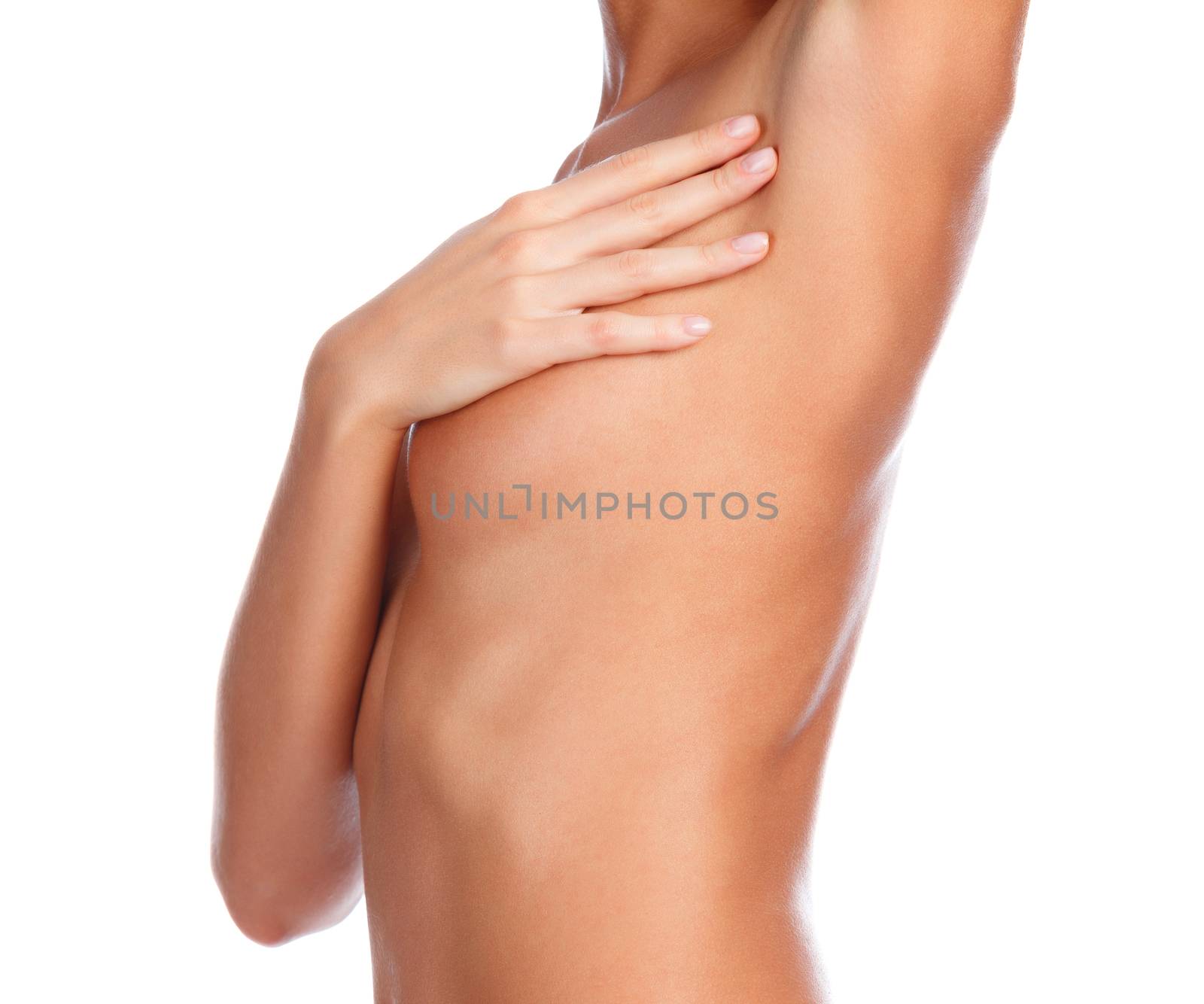 Beautiful female body, isolated on white background. Slim girl touches her shaved armpit. Unwanted hair removal concept