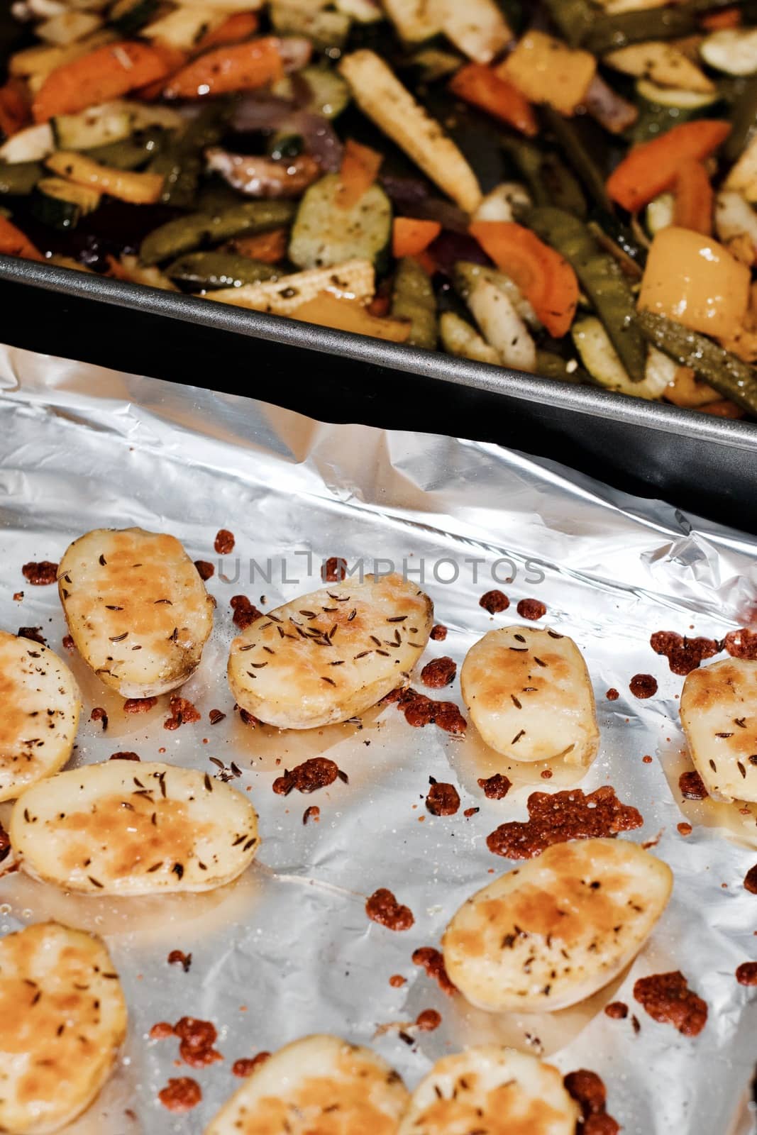 Fresh and tasty baked potatoes in the kitchen. Natural food concept.