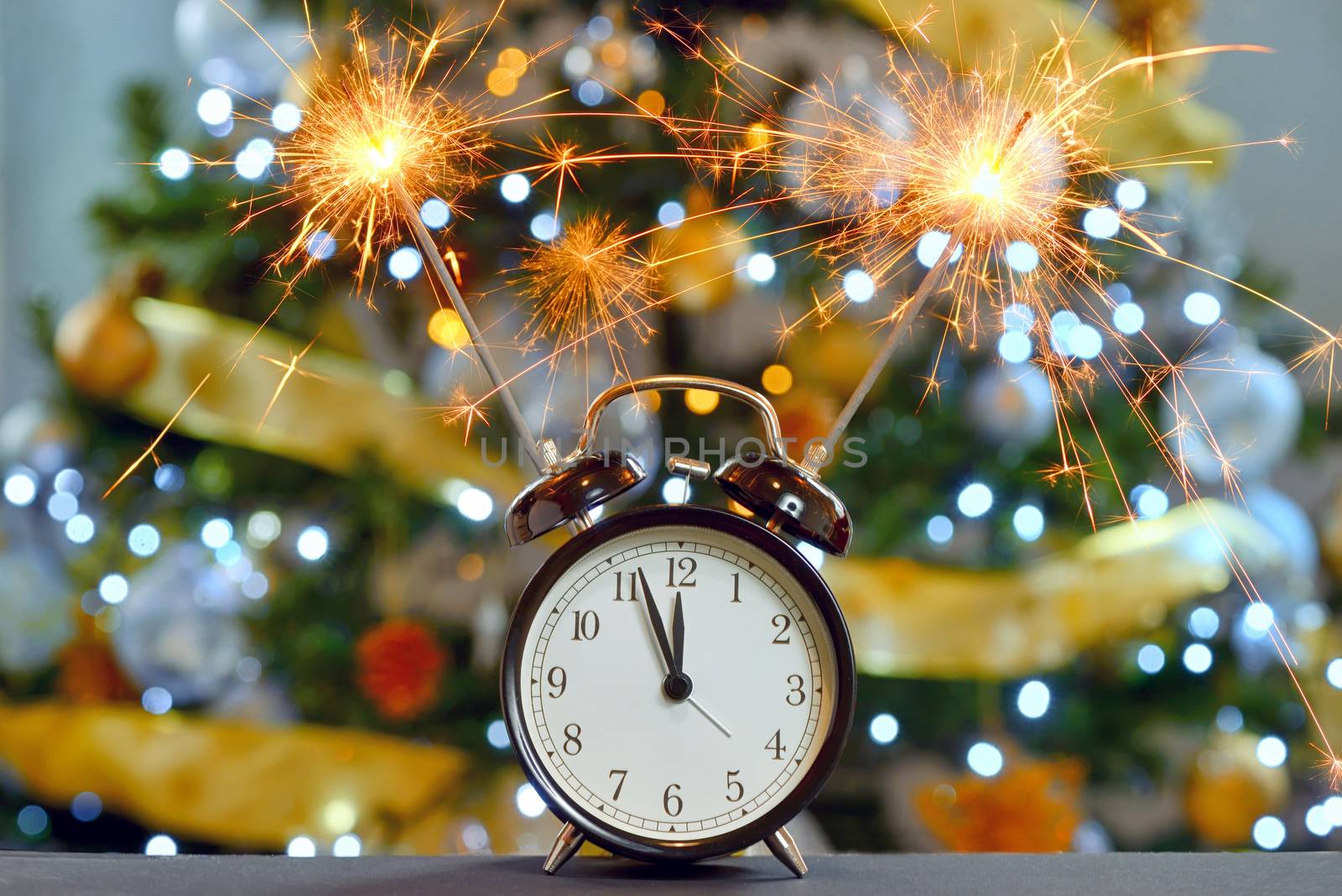 Happy New Year concept with Sparkler Fireworks and clock
