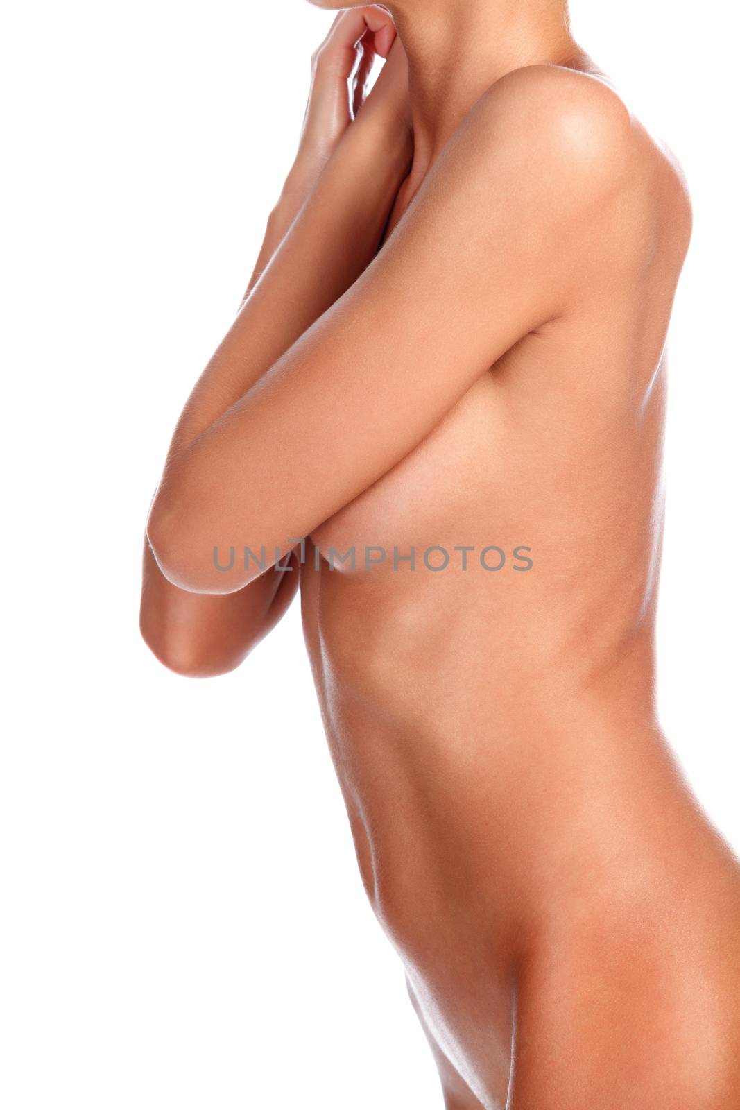 Closeup shot of beautiful female body. Slim woman posing. Isolated on white background