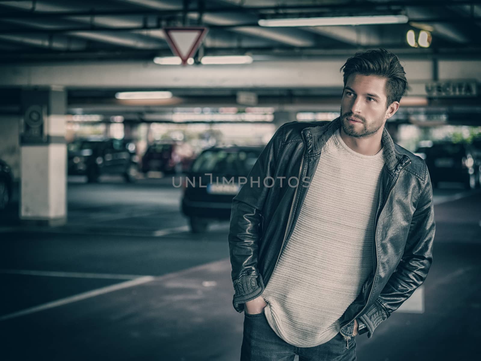 Confident man posing on parking by artofphoto