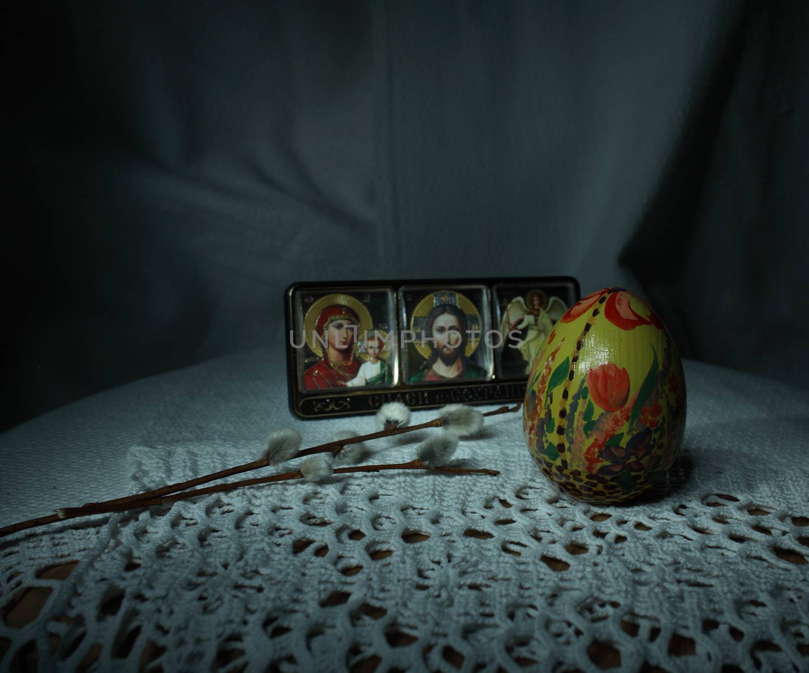 Easter Painted egg with willow twig next to the icon, Easter theme