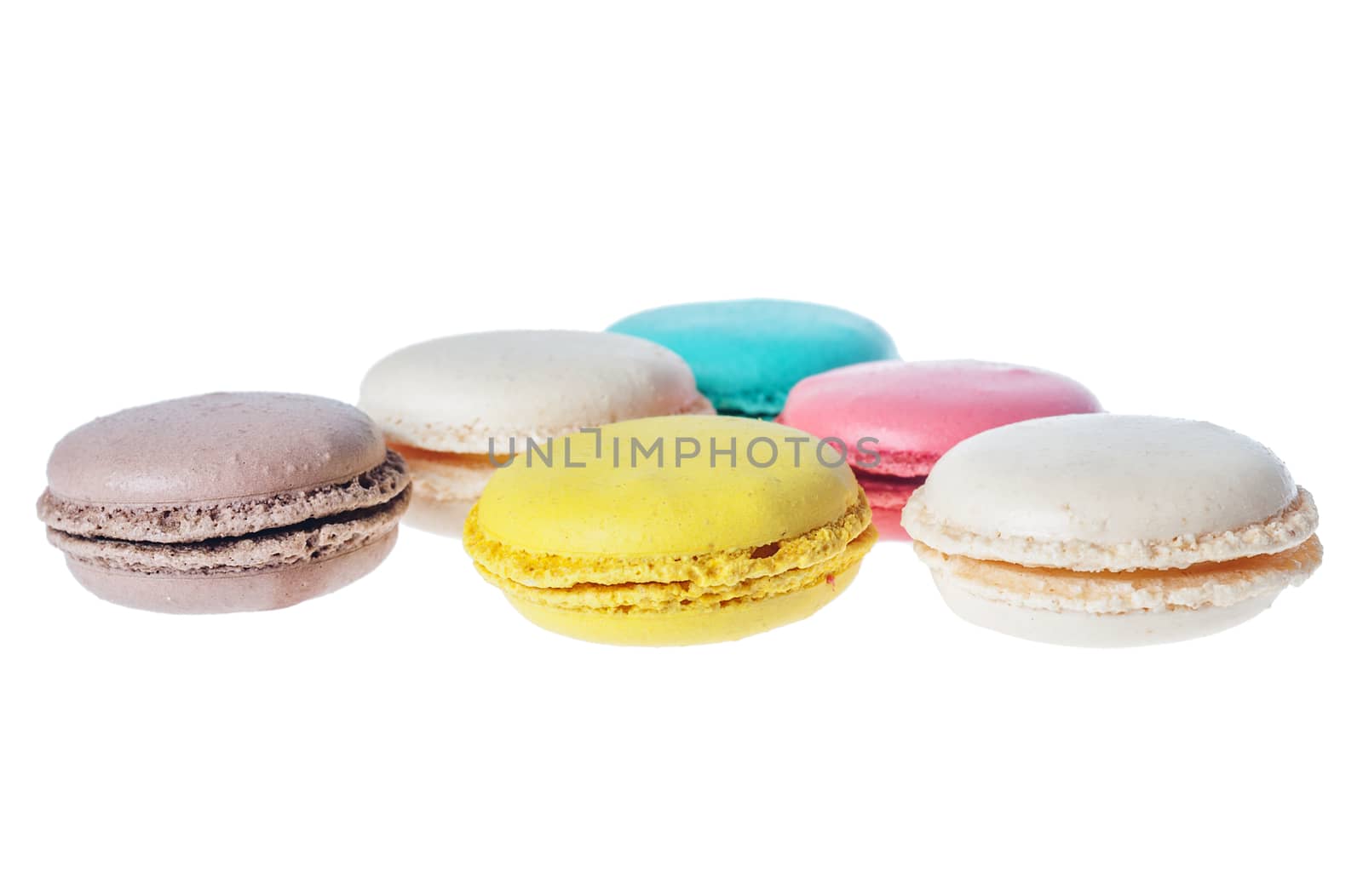 Sweet macarons. Different french cookies macaroons isolated on white