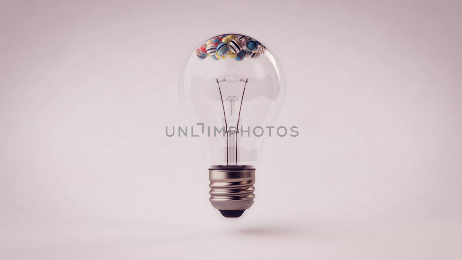 A pop art 3d rendering of a common transparent glass ligh bulb with a metallic wire and small striped and multicolored balls in it. The light bulb is placed in the grey background. 