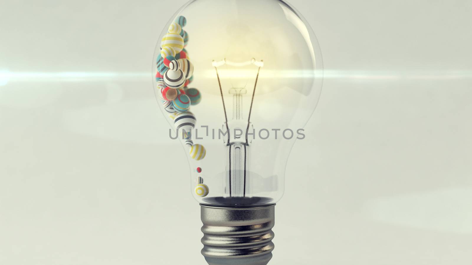 An arty 3d rendering of a transparent glass ligh bulb with a a lit metallic wire and small multicolored and striped balls in it. They are placed in the left part of a lamp in the grey background. 
